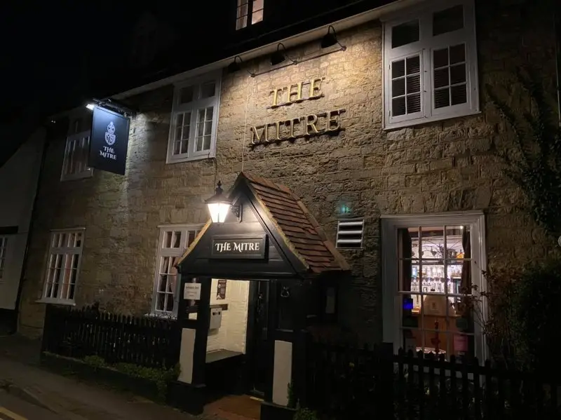 Frontage of The Mitre Pub in Buckingham with Swingsign and Lights